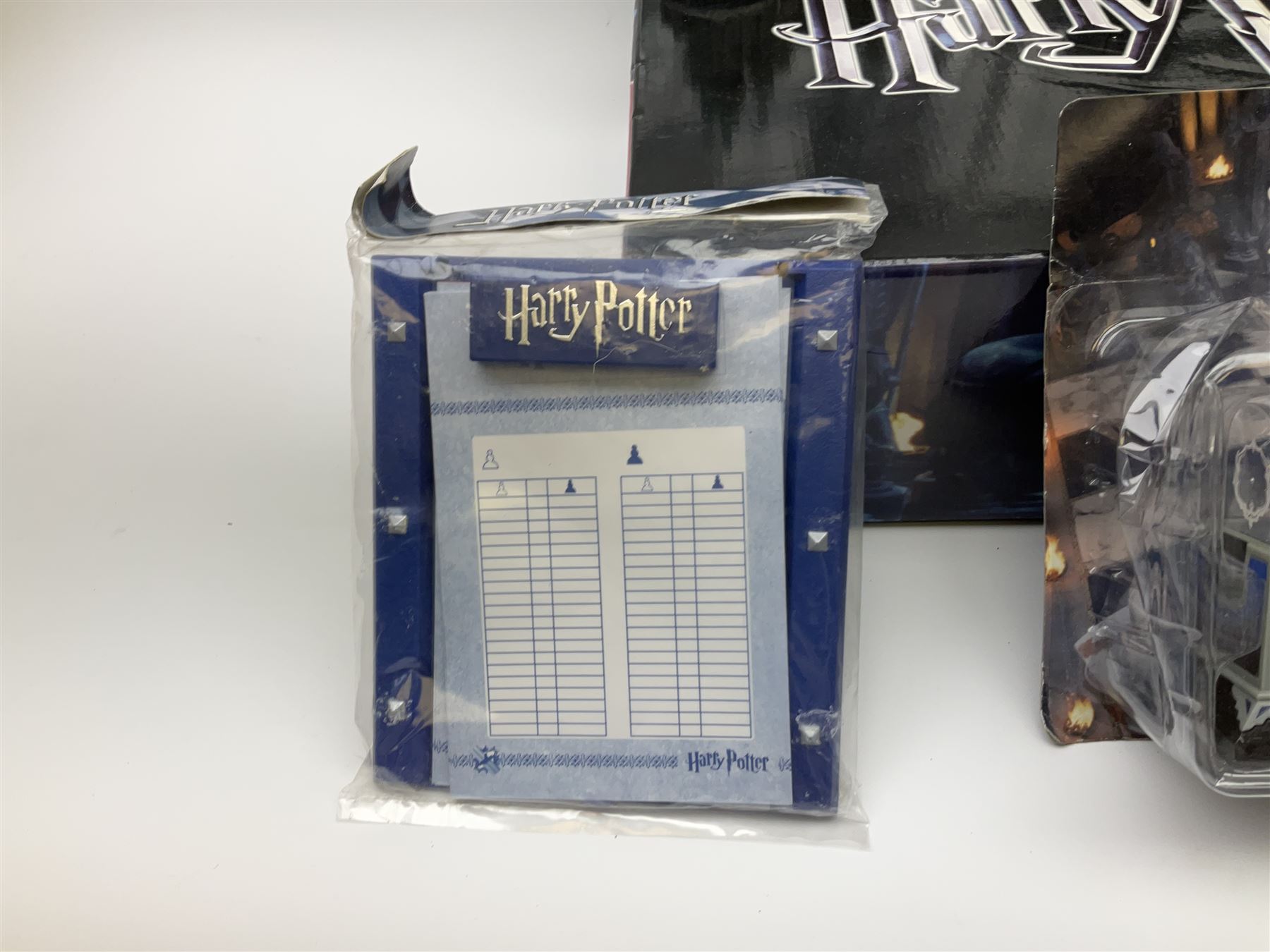 Complete DeAgostini Harry Potter chess step by step course with accessories, wand etc, including periodicals Nos. 1-82 (lacking No.68) with four binders, two chess sets with framed board, one traditional style the other fantasy, in original box.