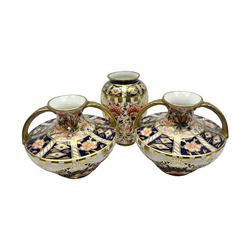 Pair of Royal Crown Derby 6299 imari miniature two-handled vases, together with another miniature vase of baluster form, all with printed mark beneath, tallest H8cm 