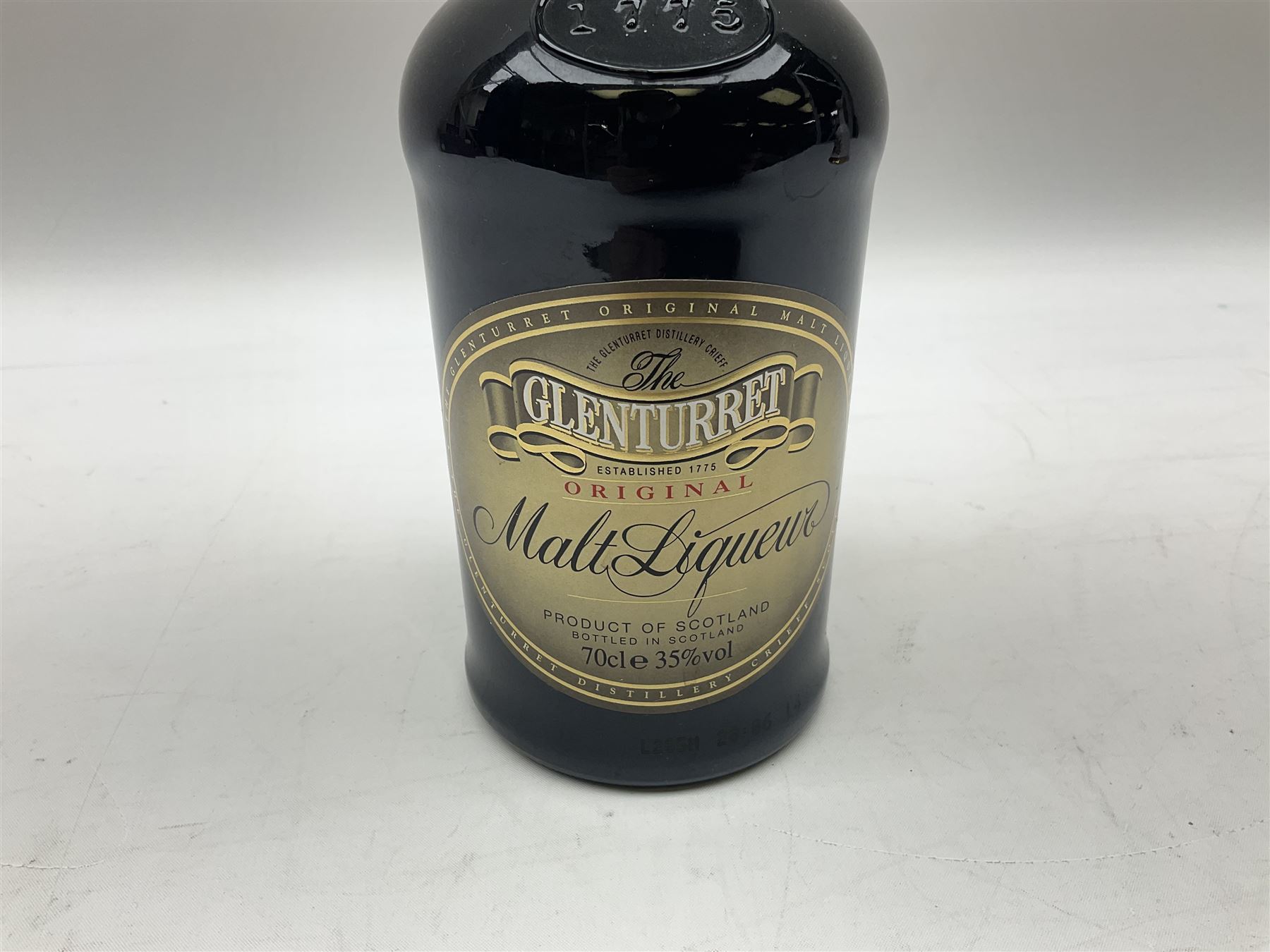 The Glenturret malt liqueur, 70cl, 35%vol and a Bell's Scotch Whisky decanter commemorating The marriage of Prince Andrew with Miss Sarah Ferguson 23rd July 1986, 75cl (2)