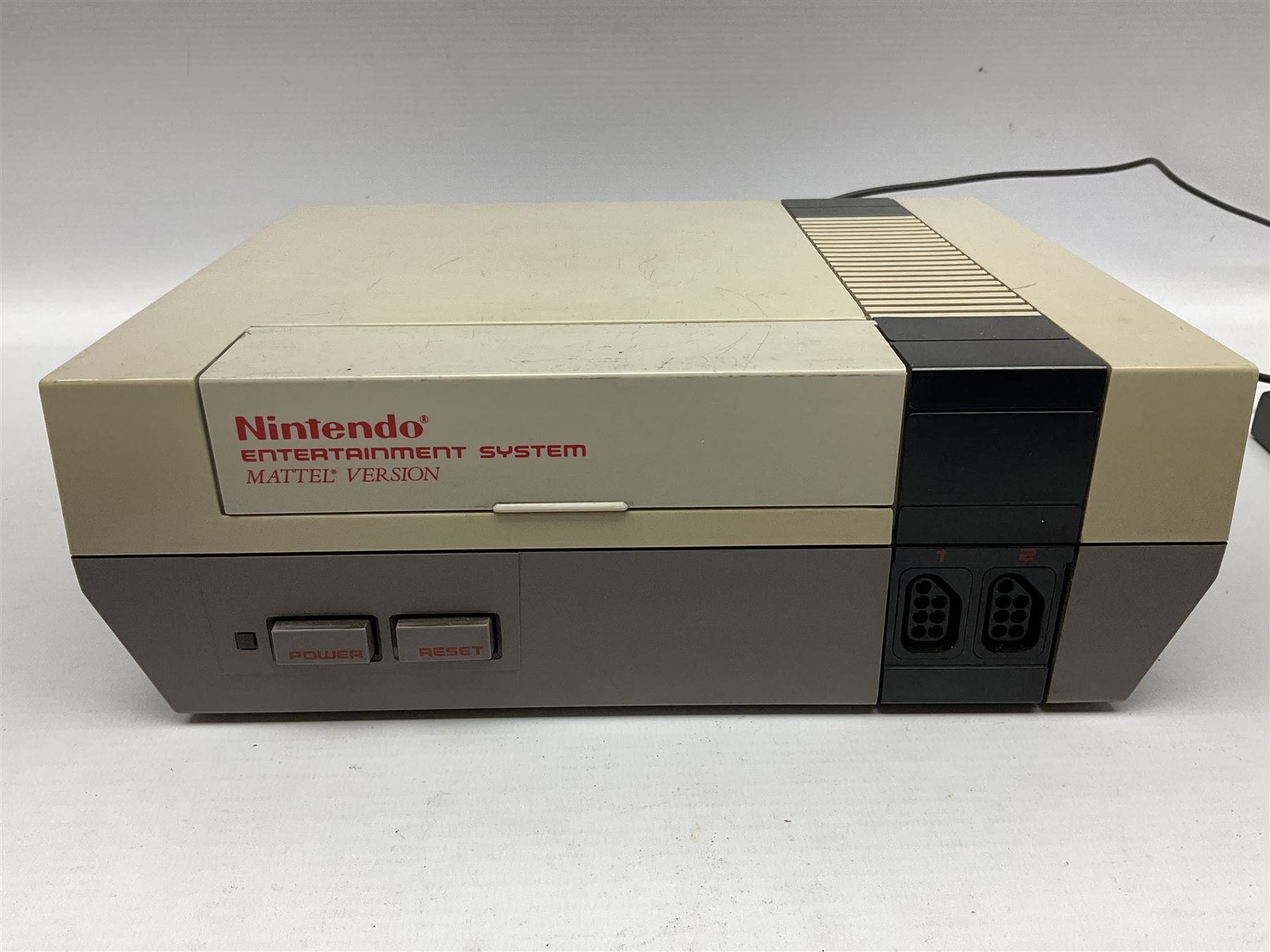 Nintendo Entertainment System (1985) console with two controllers, accessories and instruction booklet. NES Games ‘Duck Hunt’ with Nintendo Zapper gun, ‘Pinball’ and ‘Super Mario Bros.’, all with original sleeves and instruction booklets. NES game ‘Super Mario Bros. 2’ cartridge only