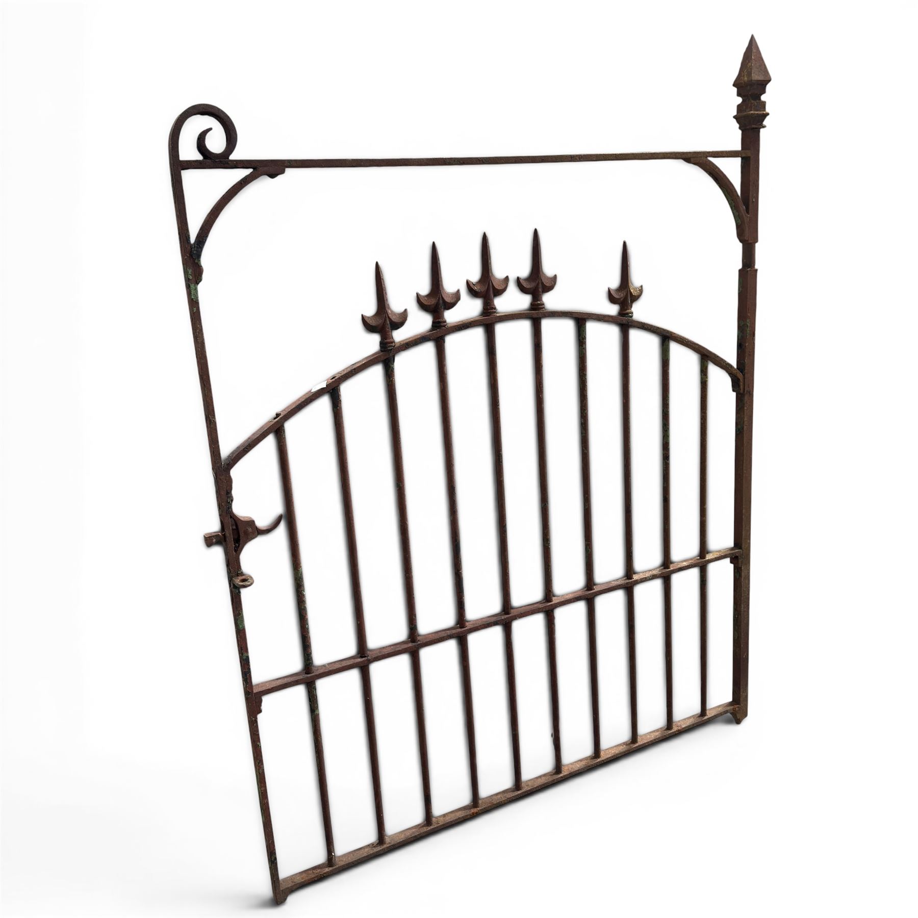 Georgian wrought iron single garden gate, pointed finial over strapwork cresting rail and arched profile with spearhead finials, the opposing side with scrollwork and hinged latch