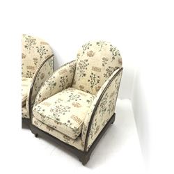 Art Deco period mahogany framed two seat settee, upholstered in a beige ground studded fabric with floral field (W134cm) and two matching armchairs (W66cm)