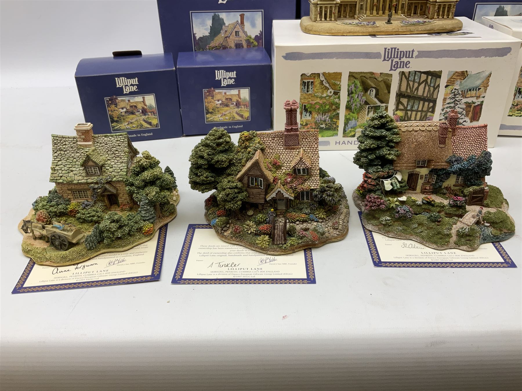 Eight Lilliput Lane models, including Gertrude's garden, Cruck End, Honeysuckle cottage, The Pottery, Huddersfield Railway Station, The Magpie Cafe, Amberly Rose, Summer Days and Shades of Summer, all boxed with deeds