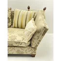 Grande Knole drop arm three seat sofa upholstered in pale fabric with raised floral pattern, with feather scatter cushions