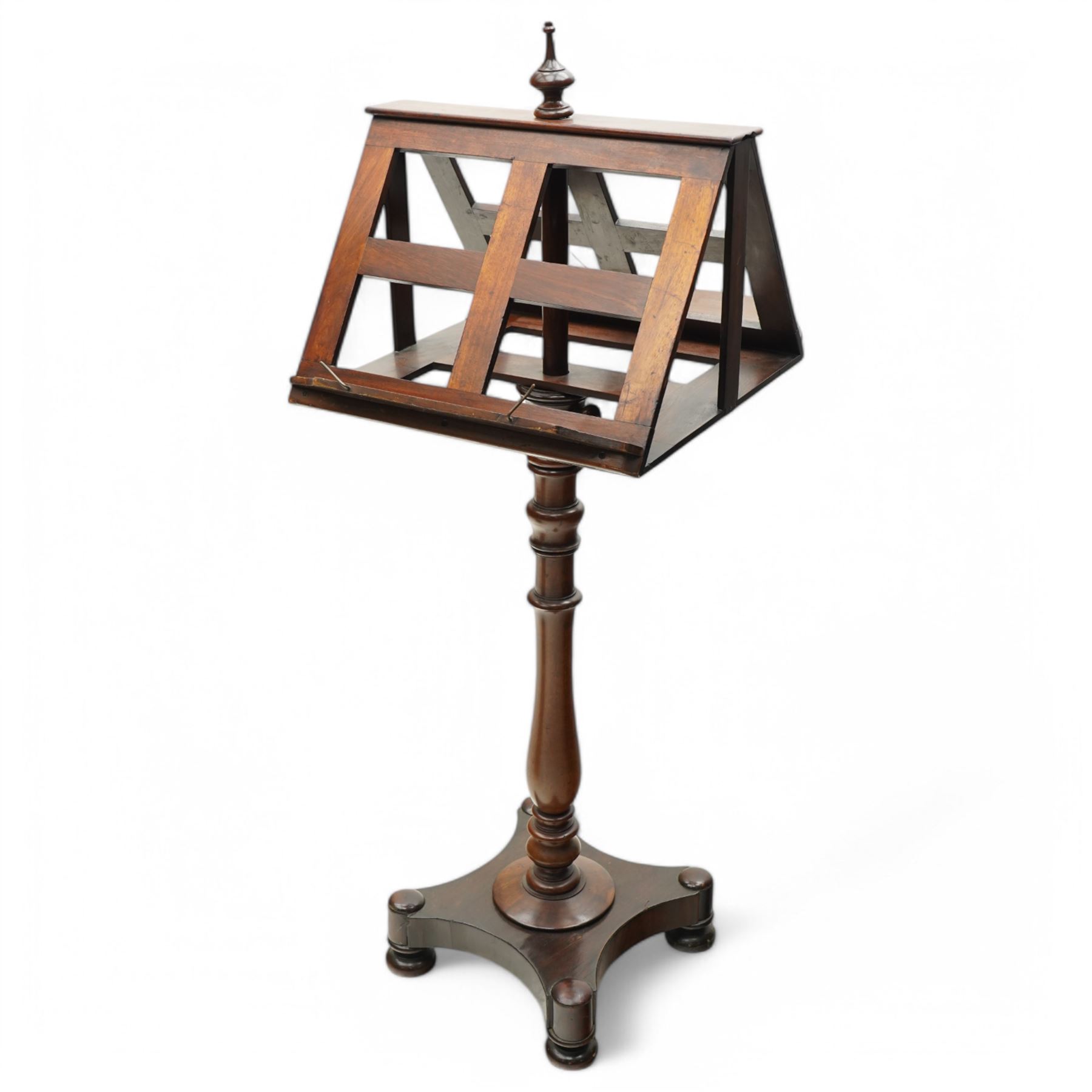 Mahogany duet music stand, twin sloped book rests on telescopic extending stem, on ring and baluster turned pedestal, shaped platform on compressed bun feet