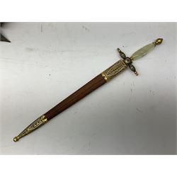 Malayan Kris dagger, the 31.5cm double edged straight heavy damascus blade with copper ferrule; carved hardwood grip; in large wooden throated scabbard with floral decorated white metal covering L47.5cm overall; a kris blade with adapted antler grip; and five various small daggers/letter openers (7)