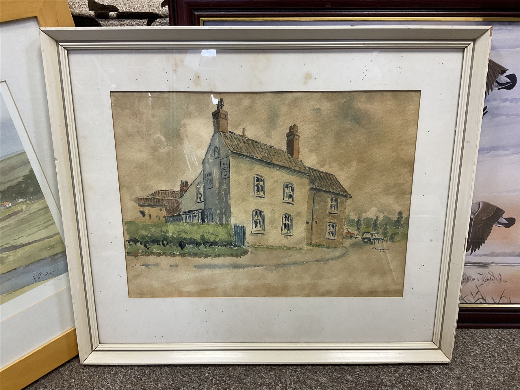 G A Townsend (British 20th century) 'The Trout Inn', watercolor signed and dated; M C W (British 20th century) The Wolds watercolor signed and dates, together with another watercolour and three landscape prints