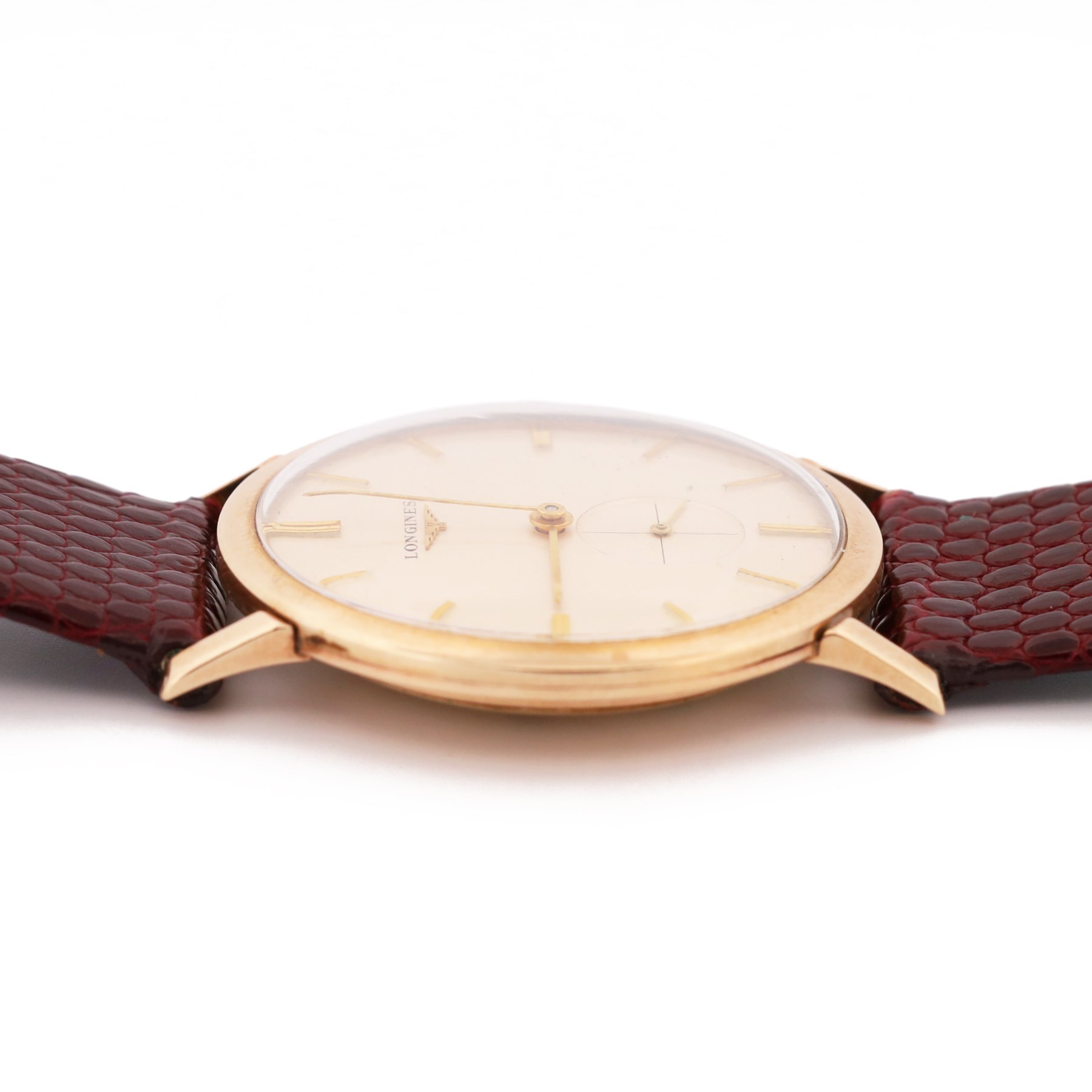 Longines gentleman's 9ct gold manual wind presentation wristwatch, Cal. 19.4, silvered dial with baton hour markers and subsidiary seconds dial, London 1960, on burgundy lizard strap