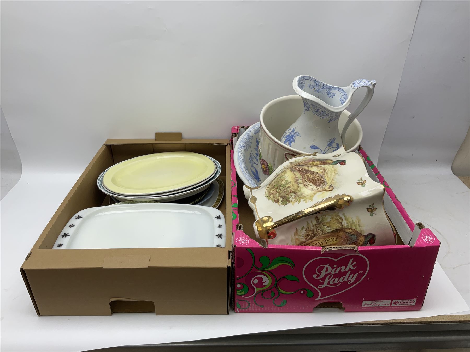 Two Poole Pottery dinner plates and a meat plate, four Copeland Spode Bermuda pattern dinner plates, Sadler jug, Keele St Pottery cottage tea wares, Torquay Motto ware, blue and white jug and bowl, two large planters and other ceramics, etc, in four boxes 