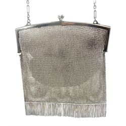 Continental Art Deco silver mesh purse with chain fringe, and carry chain stamped 925, the clasp opening to reveal a chamois leather lining, stamped 925,  also bearing import marks for Birmingham 1913, makers mark EGB, approximate gross weight 11.70 ozt (364 grams)
