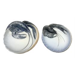 Pair of Royal Copenhagen bowls modelled as baskets and mounted with lobsters, model no 3498 and 3277, with painted and printed marks beneath, largest D19cm