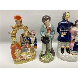 Collection of Victorian and later Staffordshire style figures, to include Prince Albert, the royal children, spilt vases etc, together with Victorian fairings
