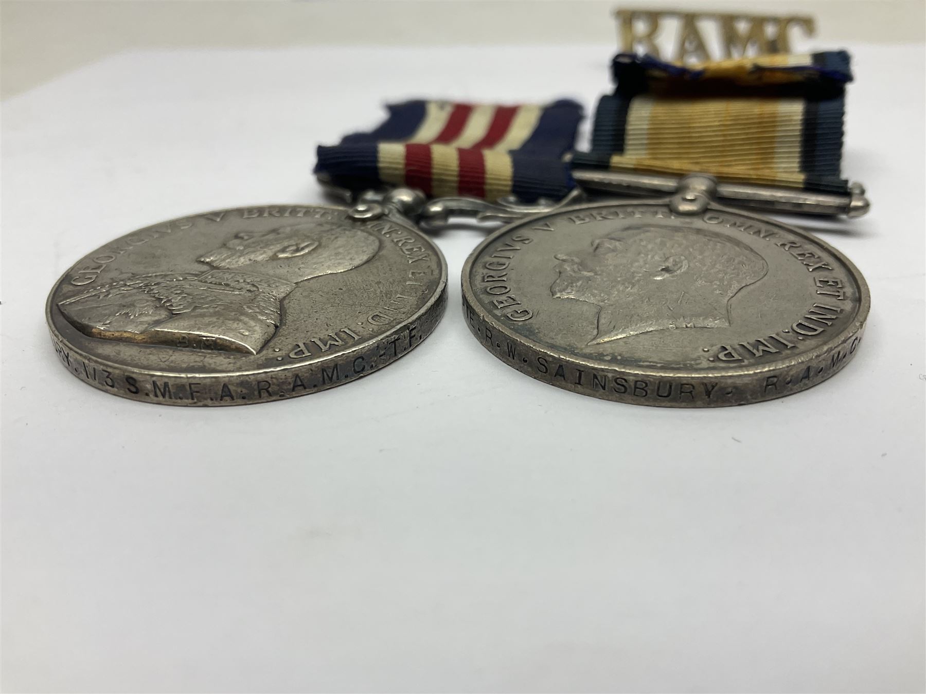WWI RAMC Military Medal group of four comprising MM awarded to 439278 Pte. R.W. Sainsbury 1/3 S.M.F.A. R.A.M.C. T.F., British War Medal, Victory Medal and 1914-15 Star awarded to 2160 Pte. R.W. Sainsbury R.A.M.C.; all with ribbons; together with RAMC shoulder title
