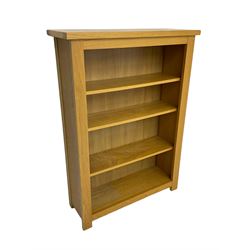 Oak open bookcase, fitted with three adjustable shelves