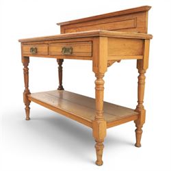 Edwardian oak serving table, raised panelled back over moulded rectangular top, fitted with two frieze drawers with brass drop handles, fluted front uprights, on turned supports united by potboard undertier