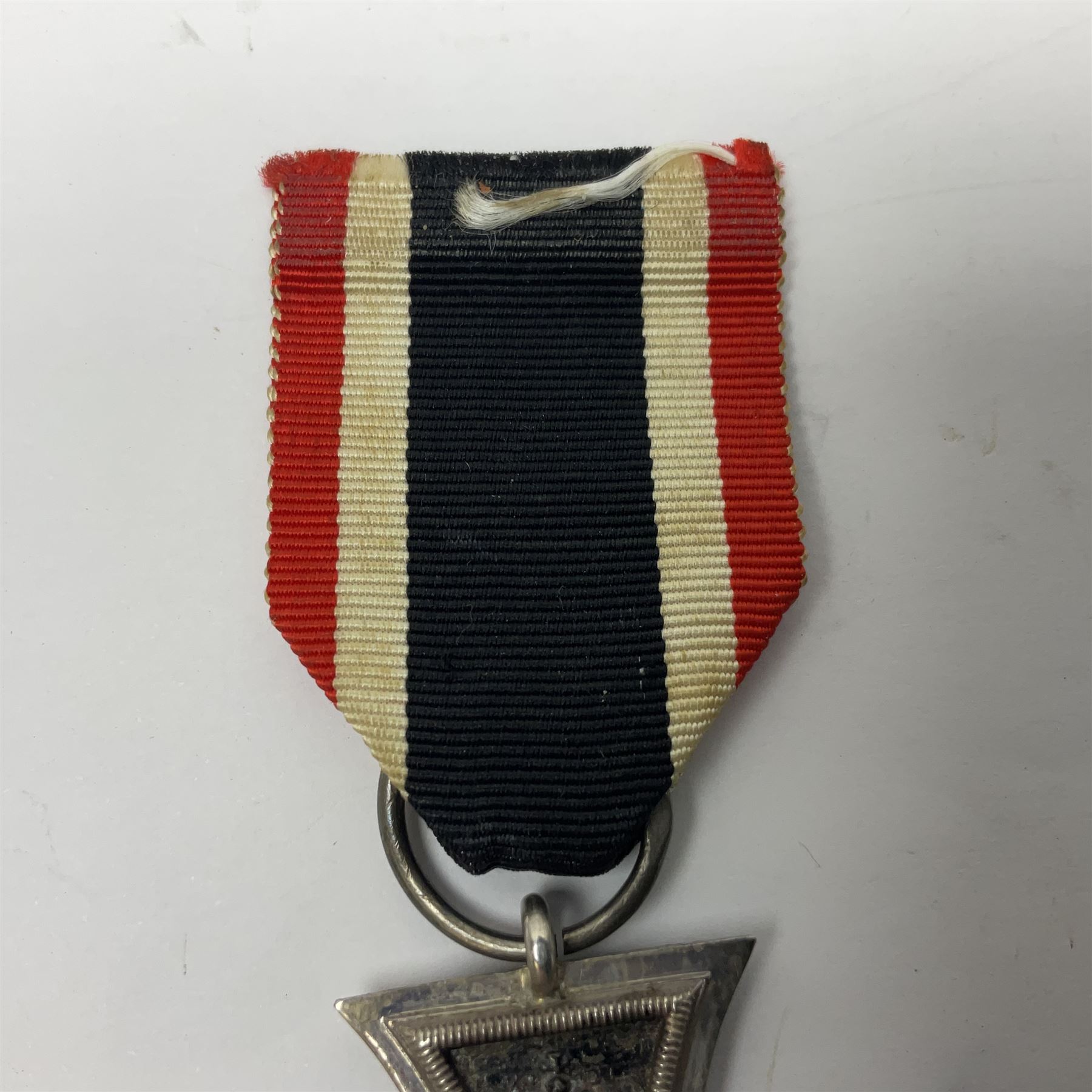 WWI Imperial German Iron Cross 2nd Class, the suspension ring indistinctly stamped M8?; with WWII ribbon