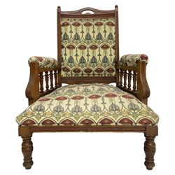 Early 20th century armchair, back and sprung seat upholstered in Art Nouveau patterned fabric, raised on ring turned supports, the frame with all-over reeded decoration