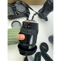 Six Minolta Dynax SLR camera bodies, comprising 800si serial no. 62703606, three 7xi examples, including one boxed example, serial nos. 20106944, 16123311 & 22107553, and two 9xi examples, serial no. 18209901 & 18202113, with three Minolta lenses, including Zoom xi 28-105mm 1:3.5(22)-4.5 lens, AF Zoom 28-85mm 1:3.5 (22)-4.5 lens and an AF Zoom 75-300mm 1:4.5(32)-5.6 lens, Hama carry case and other accessories
