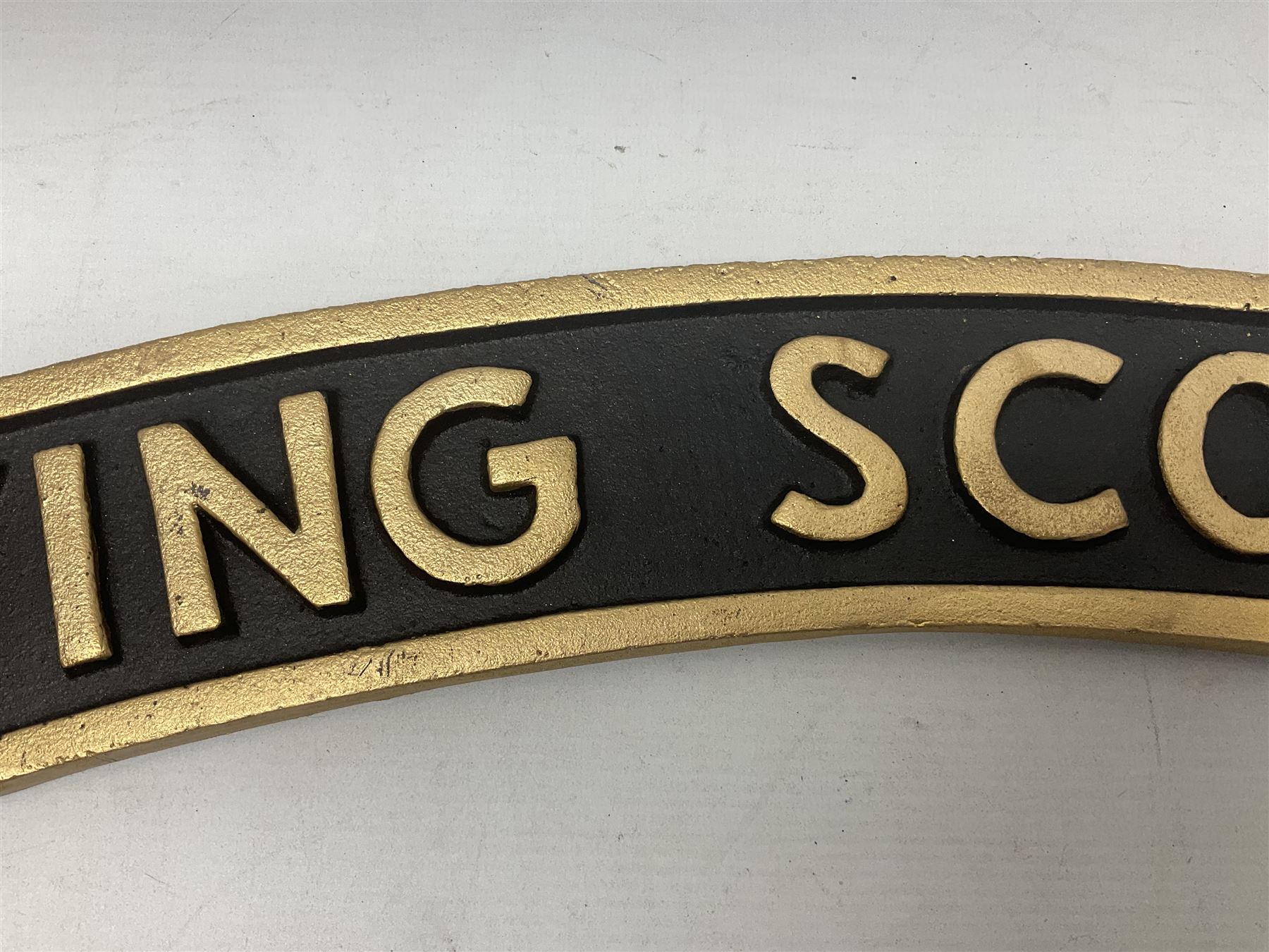 Cast iron Flying Scotsman arched railway type sign, L70cm