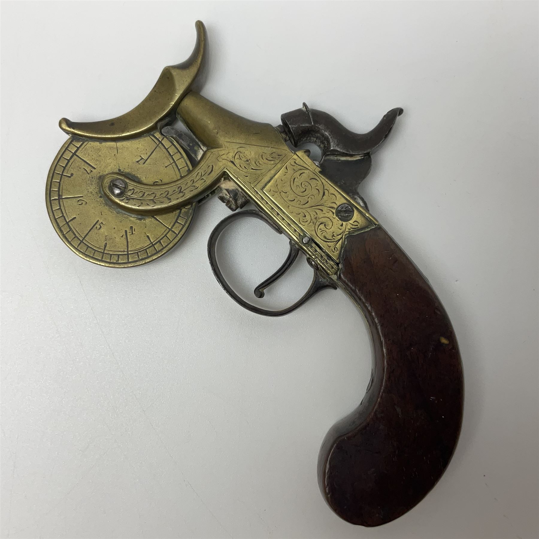 19th Century percussion eprouvette or gunpowder tester, with foliate engraved brass box lock and calibrated ratcheted wheel, steel trigger guard and walnut bag butt, L14cm