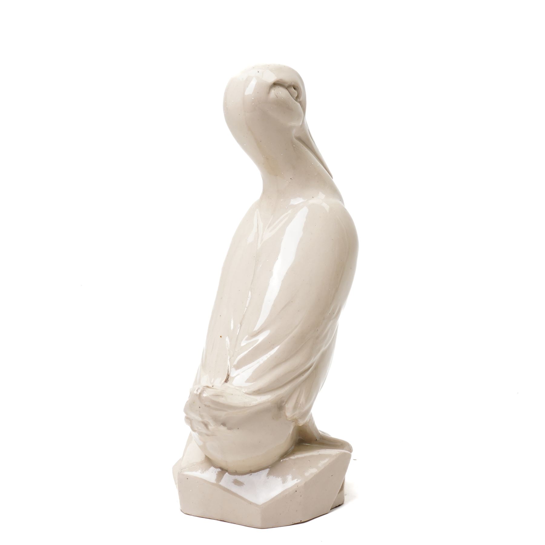 Early 20th century glazed figure of a duck perched upon a rock, signed 'E Grater' and dated 1935, H30cm 