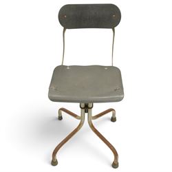 Pair of mid 20th century 'Tan-Sad' industrial chairs, black moulded fibre seats, raised on four supports
