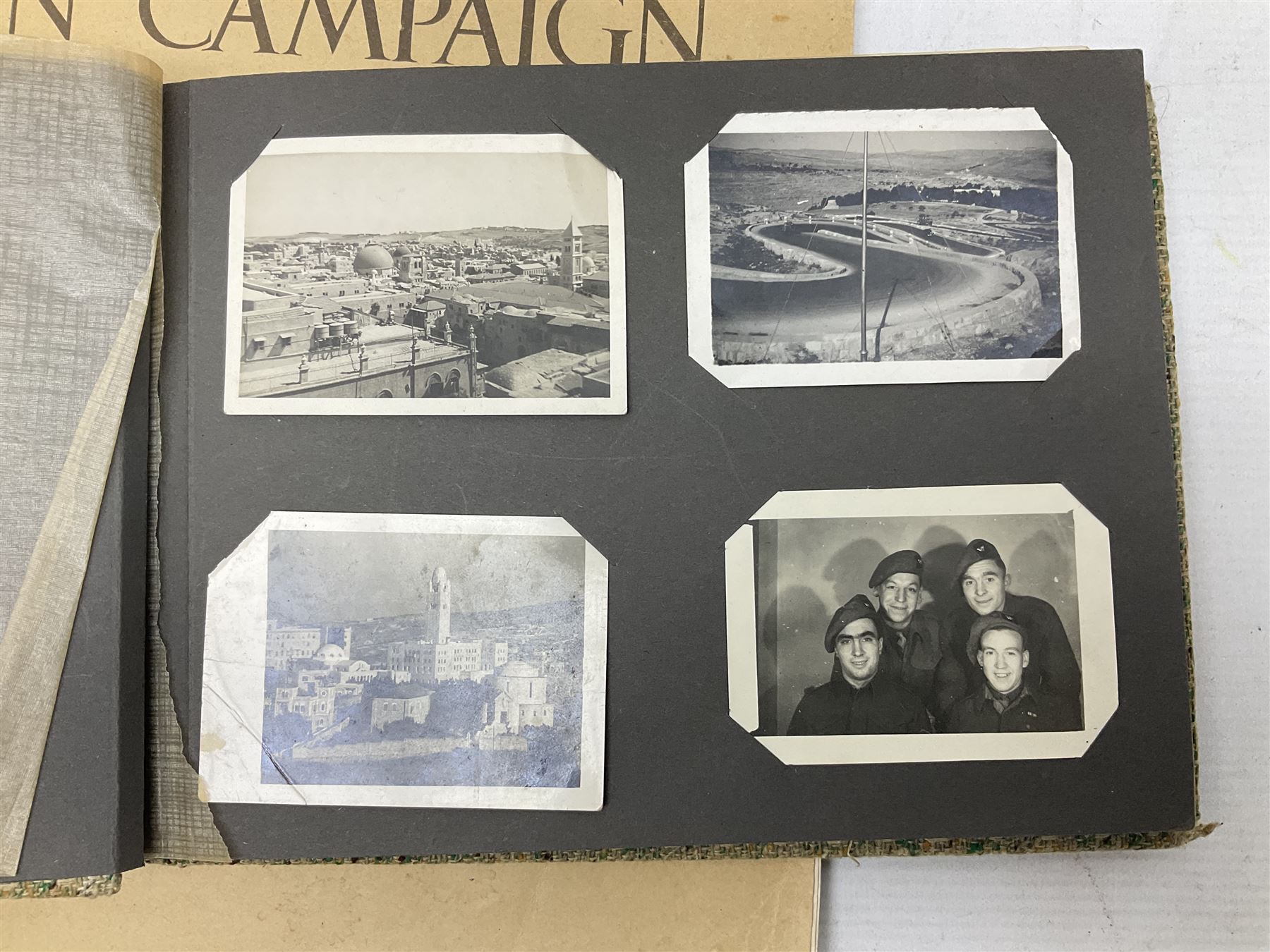 Modern album containing over sixty postcards and photographs including memorial portraits of KIA soldiers, regimental crests, comic, WW1 embroidered silk, uniforms, cap badges, camp and manoeuvre images etc; another personal photograph album of WW2 soldiers relaxing; Royal Armoured Corps booklet 'The Italian Campaign 3rd Sep. 1943 - 2nd May 1945; and other paper ephemera of military interest