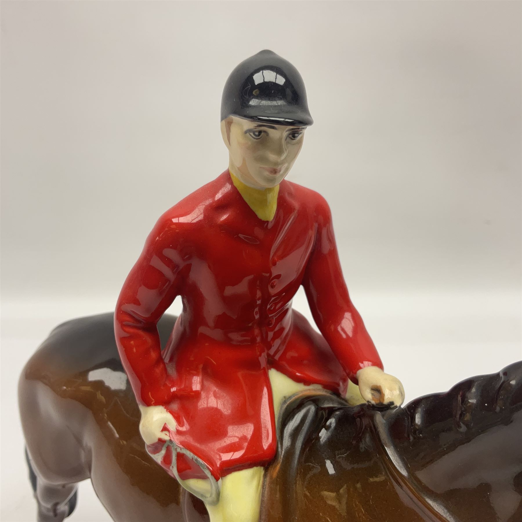 Beswick hunting group, comprising huntswoman on dappled grey horse no 1730, huntsman on bay horse no 1501, two fox figures no 1440 and 1748, and four fox hounds, all with printed marks beneath (8)
