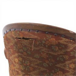 Victorian mahogany framed serpentine sofa, the shaped button upholstered back with central carved foliate cartouche, and scroll arms with carved terminals, over upholstered red seat, upon carved cabriole supports with castors