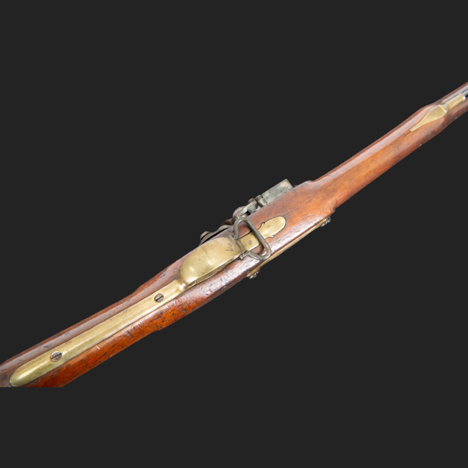 Brown Bess flintlock musket, 37in barrel, action marked with crowned GR and Tower, with brass mounts, the thinned butt marked 38, sling swivels, steel ramrod, overall L132cm
