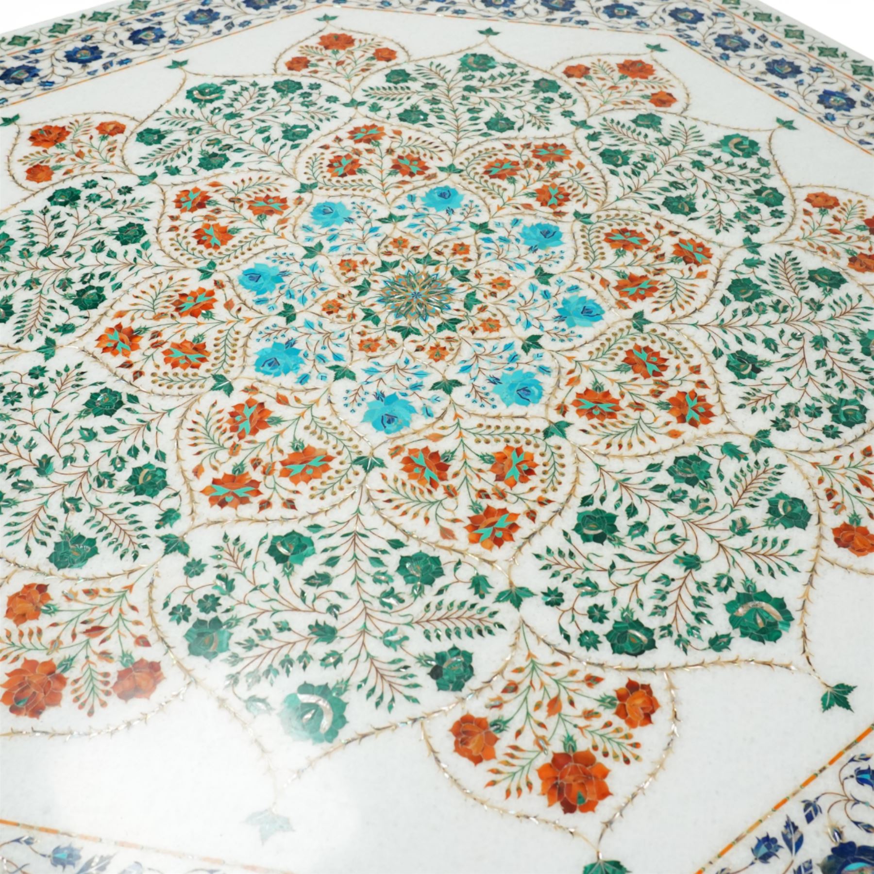 20th century Florentine design composite marble pietra dura centre table, octagonal white marble top inlaid with a polychrome foliate and floral medallion centred by a rosette, within a conforming floral border, raised on a faceted octagonal marble pedestal and stepped base