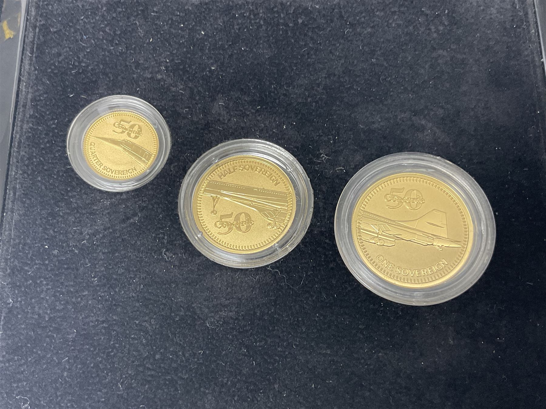 Queen Elizabeth II Gibraltar 2019 'The Concorde 50th Anniversary Gold Sovereign Prestige Set', comprising full, half and quarter sovereigns, cased with certificate, together with various items of Concorde memorabilia including cased binoculars, flight certificate for Heathrow to Moscow, 'Concorde Through The Lines' photographic tribute book etc