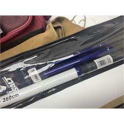 Collection of fishing memorabillia and equipment, including an Allcocks three piece split cane trout fly rod, Shakespeare Salt 3600 surf rod, two tackle bags, Old Red Seastreak multiplier reel, Sportext Saltwater fixed spool reel, fishing dvds, etc