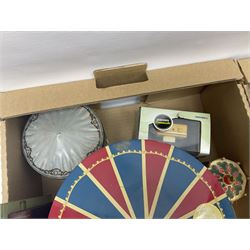 Collection of circus and fairground collectables, to include teapots, biscuit tins, including musical examples, and four Circus/fair themed books, including two library first editions