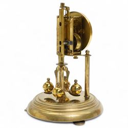 1960’s torsion clock with a skeleton movement and four ball oscillating pendulum, with a glass dome