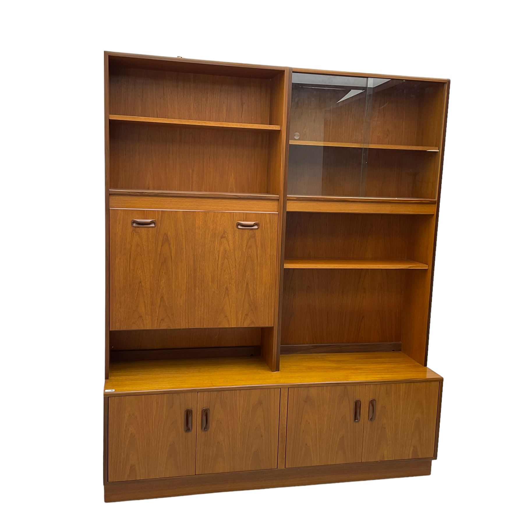G-Plan - mid-20th century teak modular wall cabinet, fitted with shelves, display cabinet, fall front compartment and two double cupboards