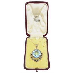 Early 20th century silver and platinum aquamarine, diamond and pearl pendant, the round cut aquamarine of approx 27.00 carat, with milgrain set diamond surround and hinged diamond and pearl set foliate drop, circa 1910-1920, in fitted box, retailed by Diss & Sons, Dewsbury