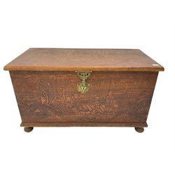 Hong Kong camphor wood chest, rectangular hinged top, carved all over with traditional scenes and dragon boats, on bun feet