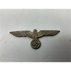Five WW2 German peaked cap badges, four with double-pinned backs