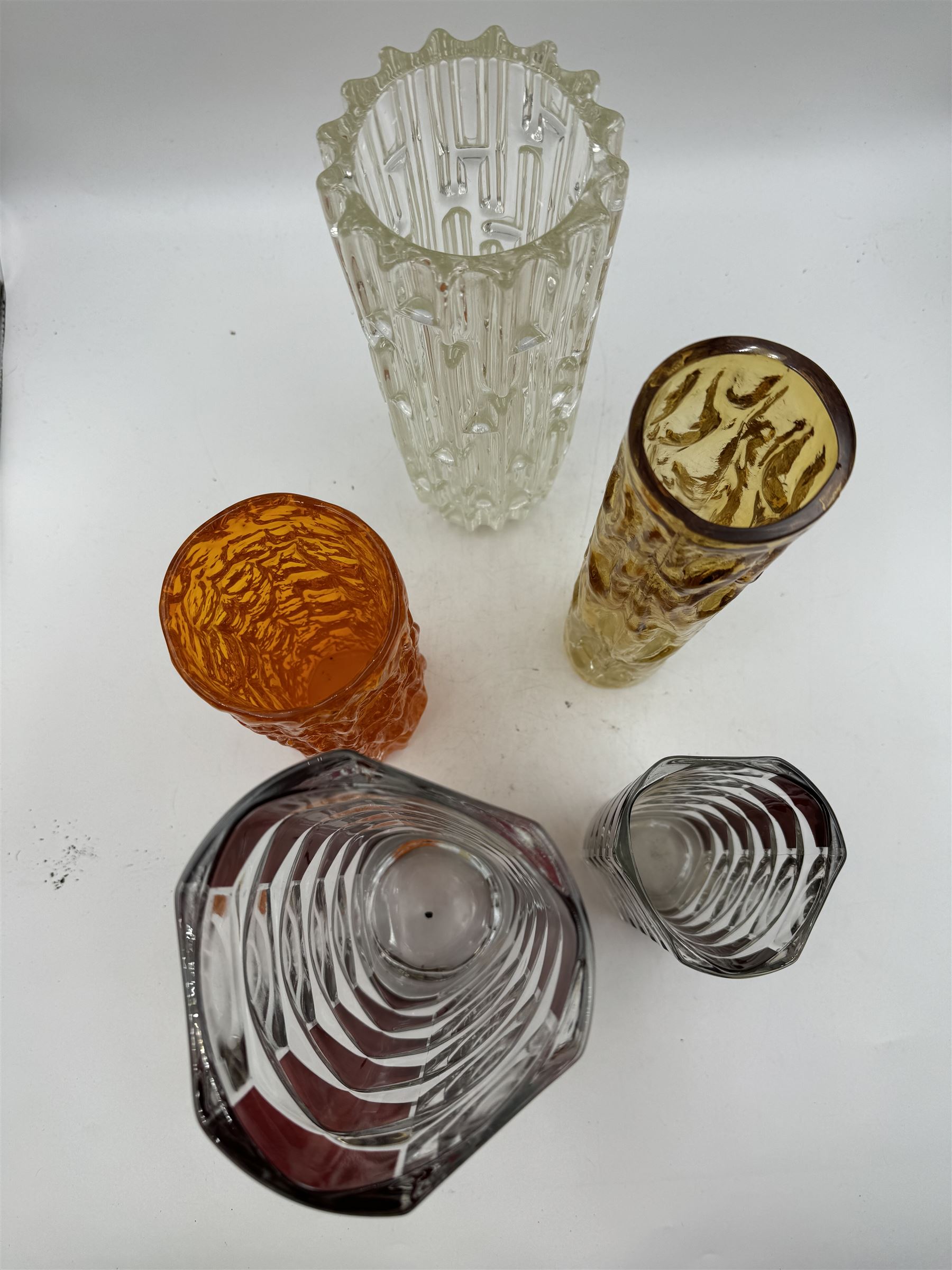 Sklo Union clear glass labrinth vase by Frantisek Vizner, together with two Luminarc geometric cranberry glass vases,Whitefriars style vase in the tangerine colourway, and one other 