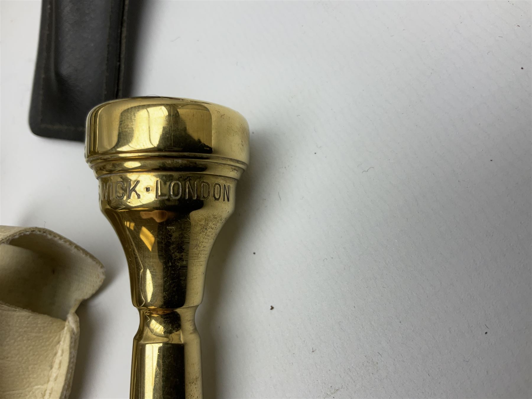 Boosey & Hawkes Emperor brass trumpet L48.5cm; in Henri Selmer carrying case with five mouth pieces and four mutes
