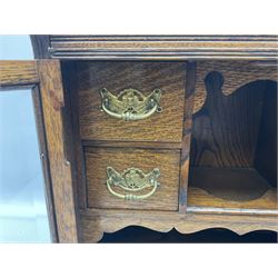 Oak smokers cabinet, twin glazed doors enclosing four small drawers and a pipe rack, H46cm