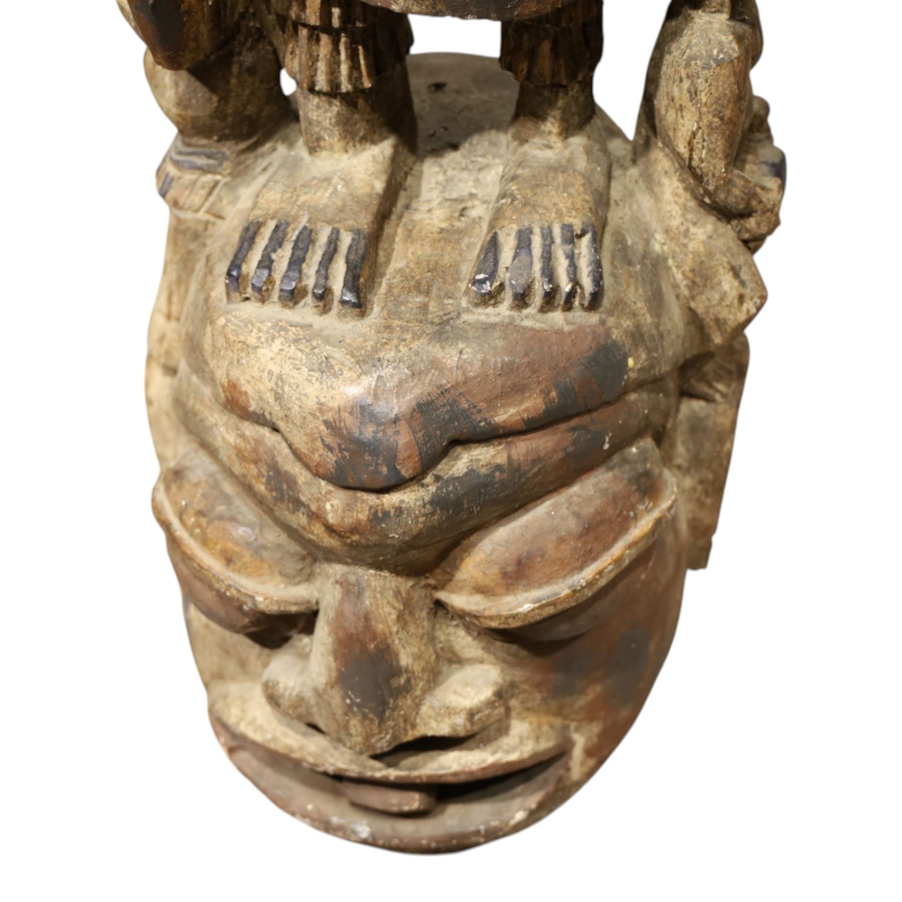 African tribal maternity figure of a woman with children, probably Yoruba, carved wood, the woman stood upon a craved mask, H133cm