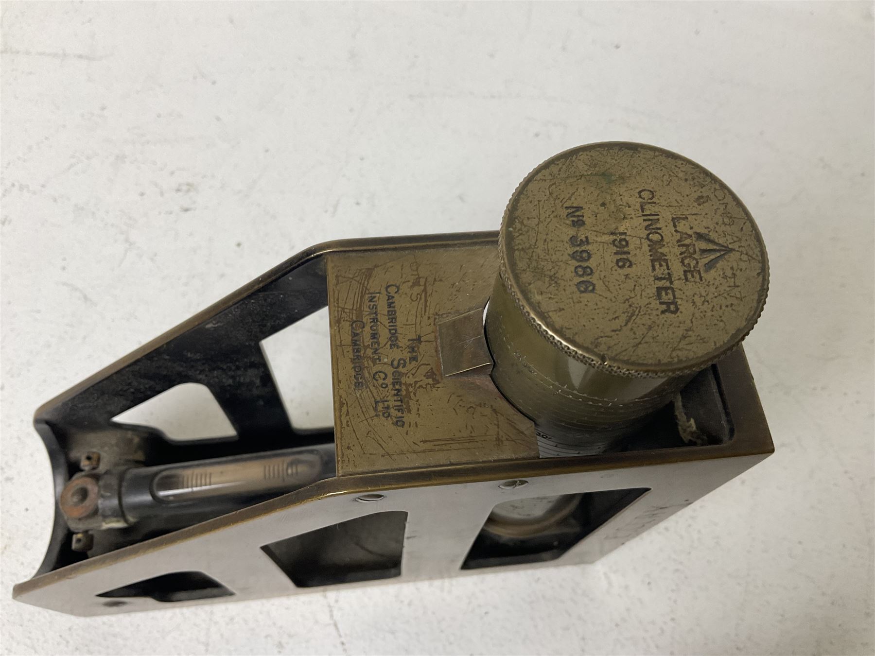 Cambridge Scientific Instruments Co clinometer, flintlock tinder lighter, and a Anders Mattson Mora patent bobbin winder (3)