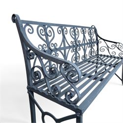 Regency period wrought iron garden bench, hand forged in wrought iron and finished in matt black paint, decorated with intricate scrollwork and featuring circular geometric ends, strapwork seat