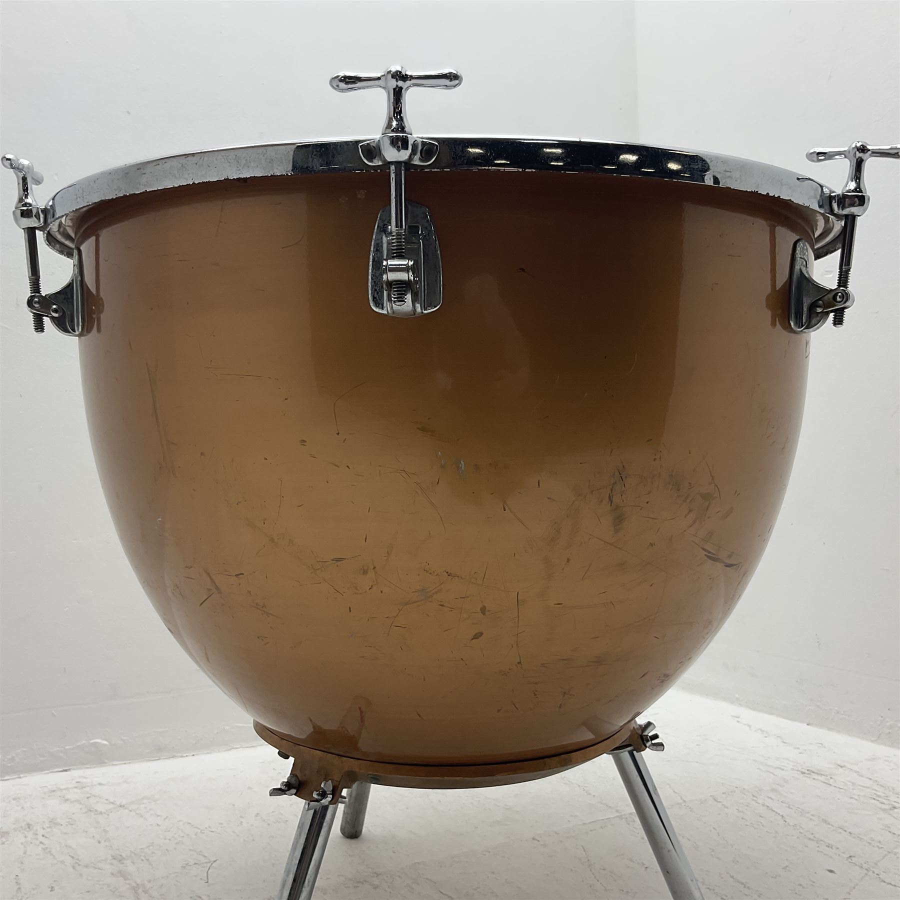 Timpani drum with coppered finish to the bowl, three adjustable tubular legs 'Marked Made in England 71 260' and Remo head D75cm 