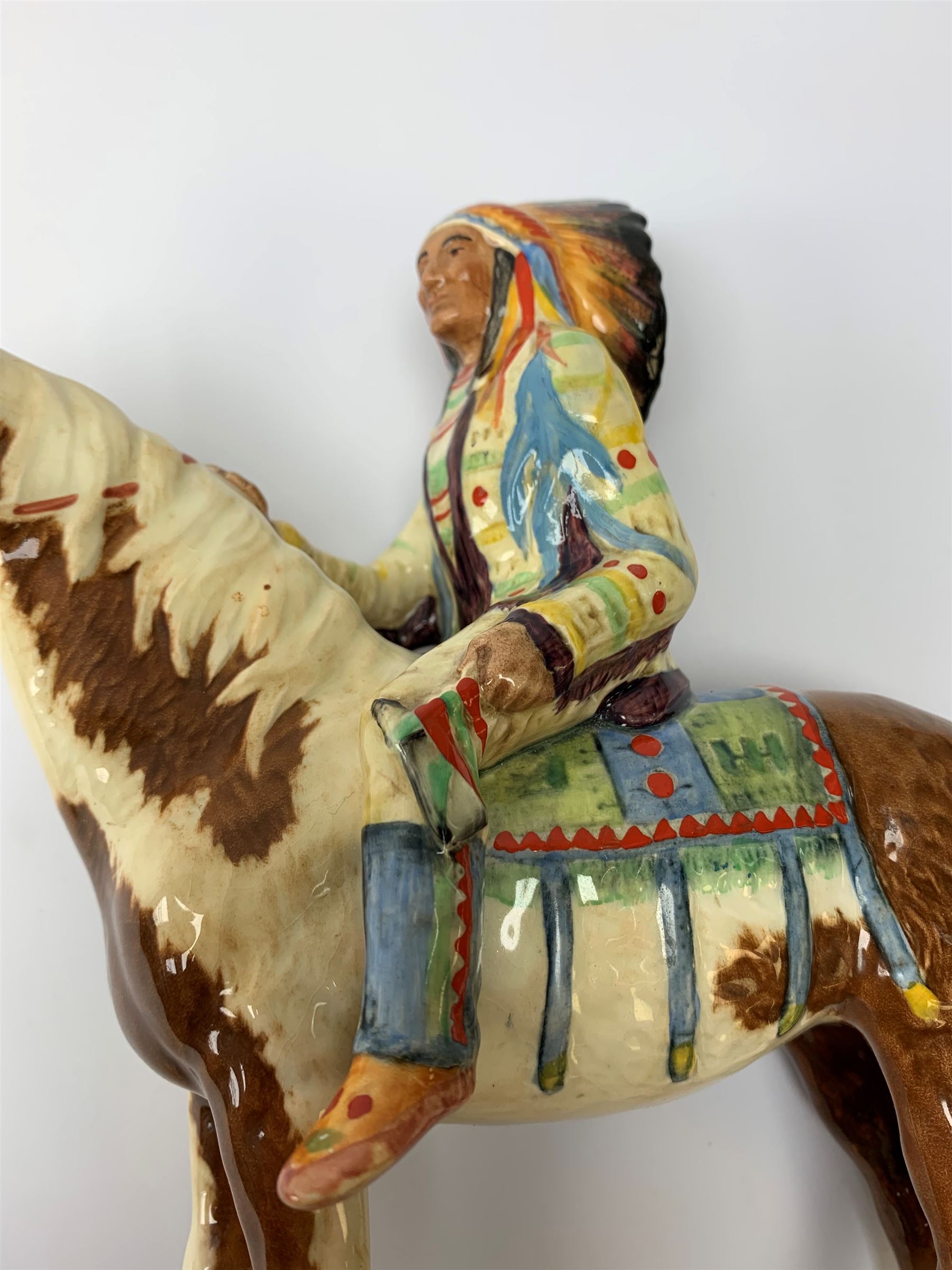 A Beswick Native American on horseback, with printed mark beneath, H21.5cm. 