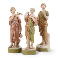 Three Royal Dux figures, Fruit Picker, no. 2082, Lady with Dove, no 2132 and Lady with Sha...