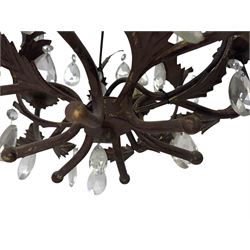 20th century distressed gilt tole chandelier, with six curved leaf clasped scrolling arms and frame, hung with lustre drops, approximately H50cm