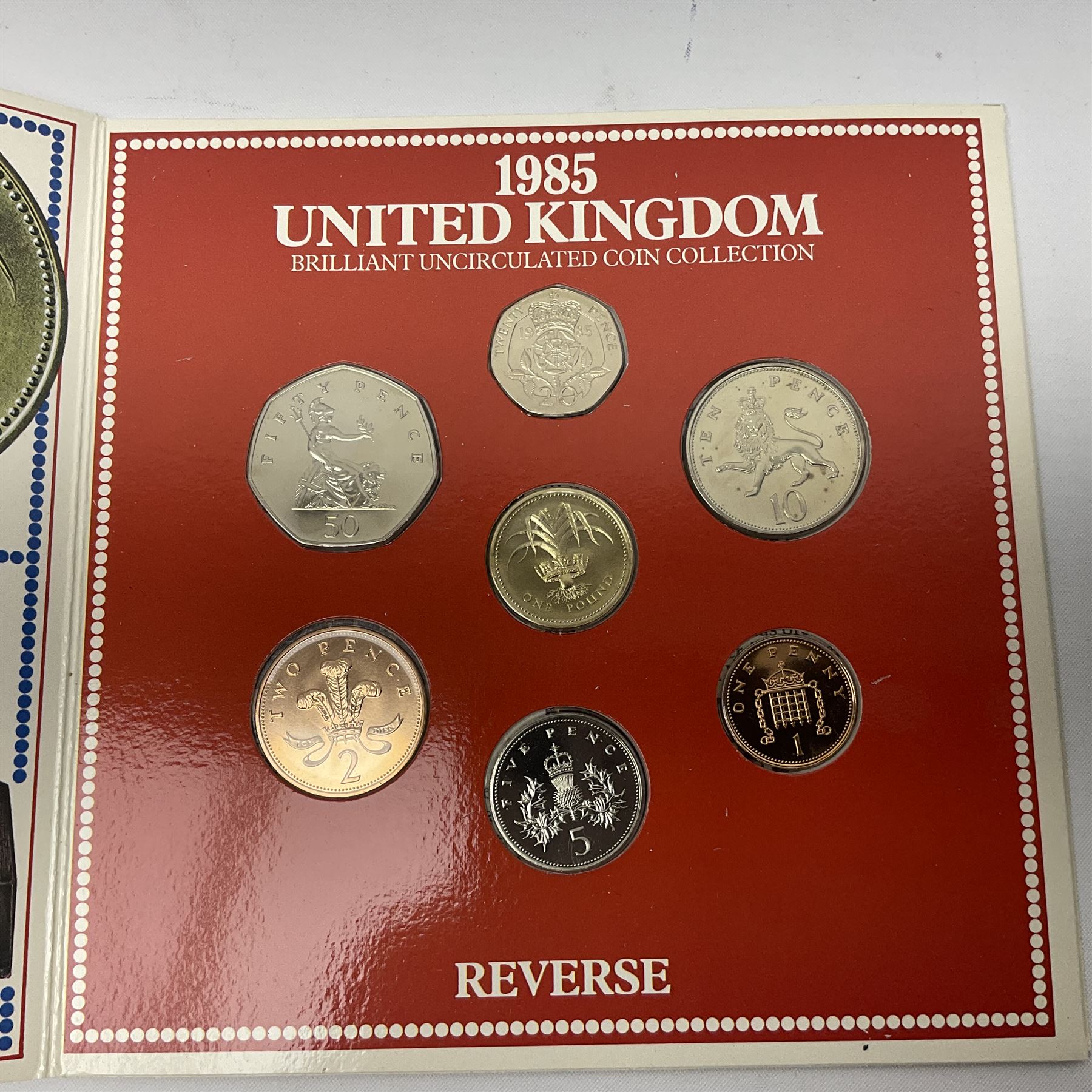 Fourteen Queen Elizabeth II United Kingdom uncirculated coin collections, dated 1983, 1984, two 1985, 1986, 1987, 1988, 1989, 1990, 1991, 1992 including dual dated 1992/1993 EEC fifty pence, 1994 and two 1995, all in card folders